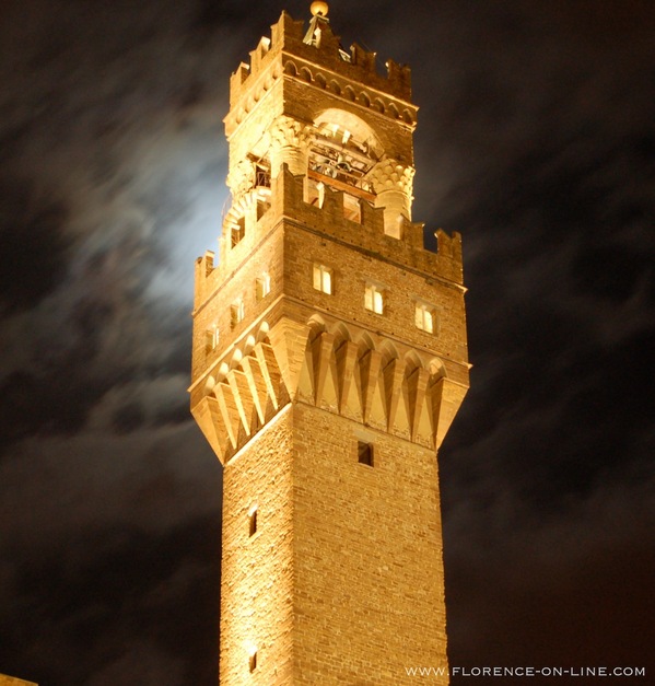 Arnolfo di Cambio's Tower of Palazzo Vecchio with a full moon behind it